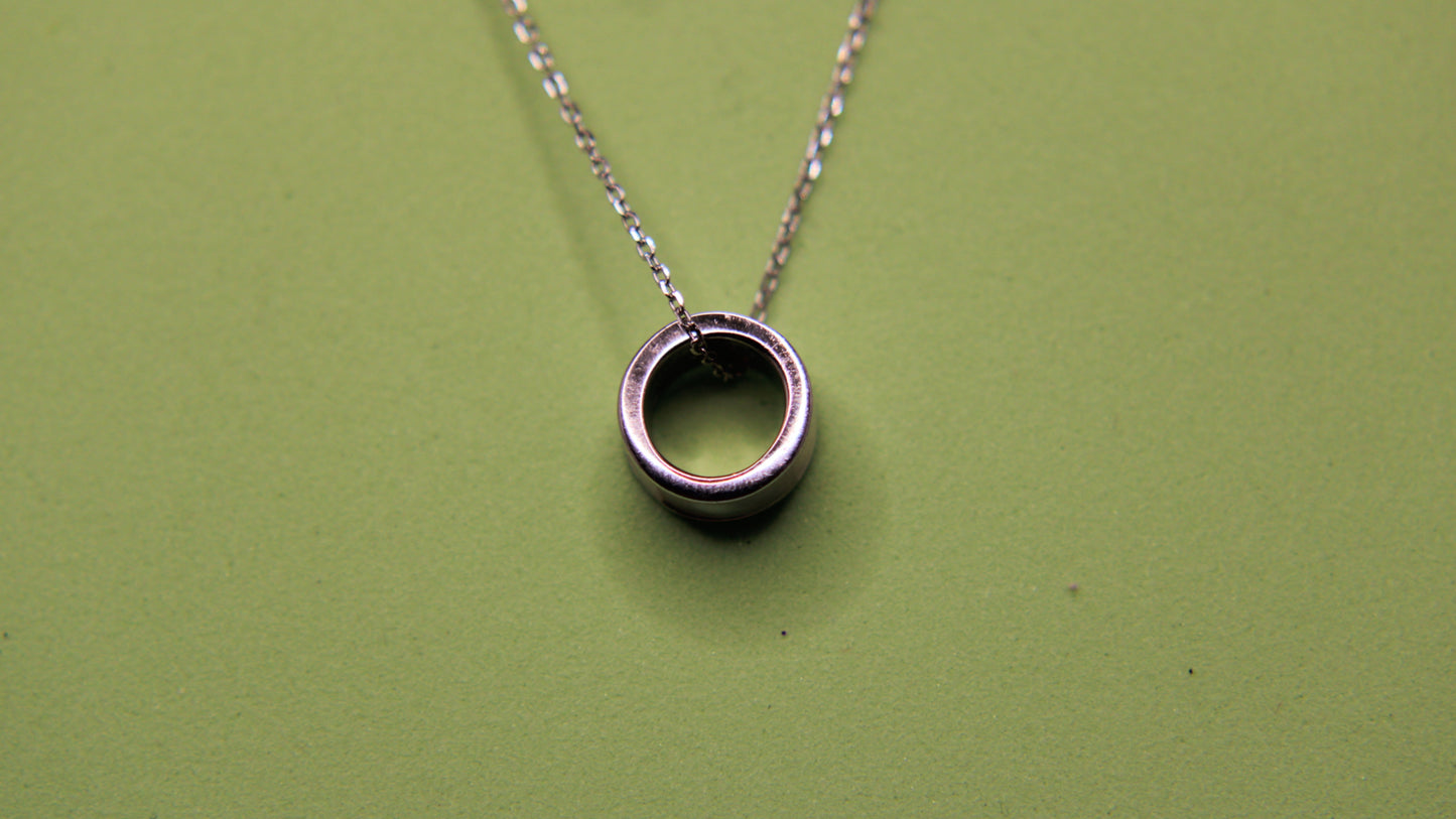 Silver necklace with a circular pendant
